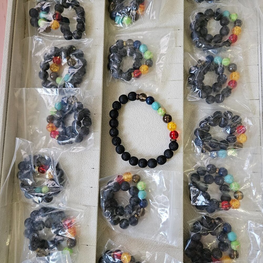 Lot of 19 black lava stone style stretch bracelets with 7 chakra accent beads.